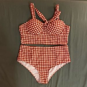 Gingham high-waisted bikini with push up padding. Cute tie detail in the front!